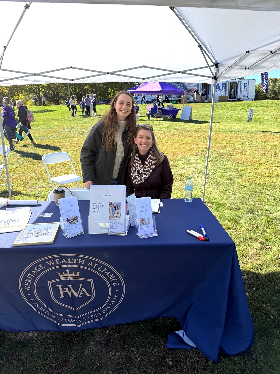 Two HWA team representatives at the sponsored event booth
